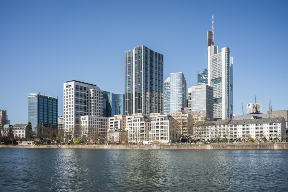 a large body of water with a city in the background