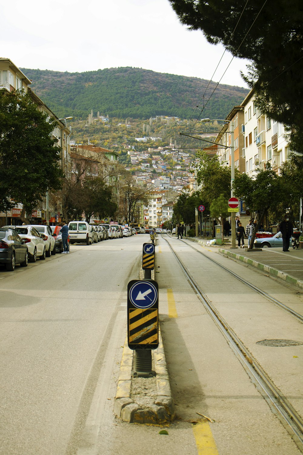 a street with cars parked on both sides of it