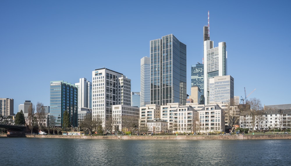 a large body of water in front of tall buildings