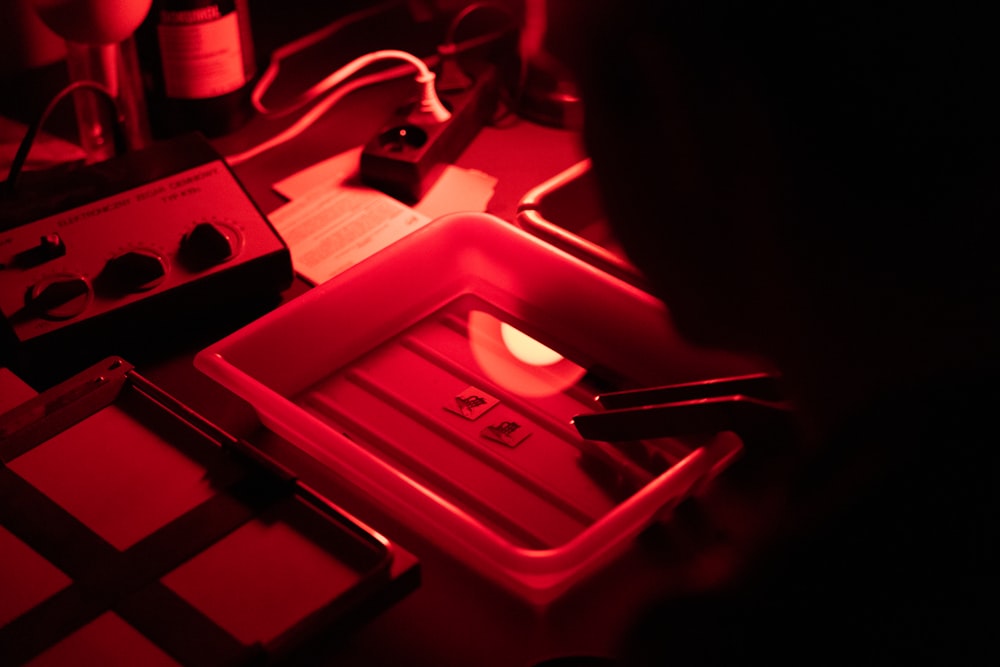 a red light is shining on a stove top