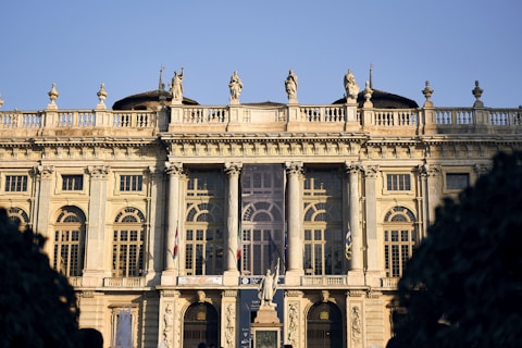 a large building with statues on top of it