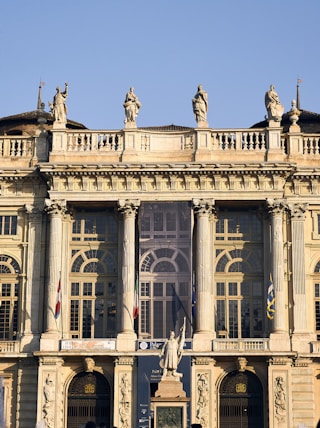 a large building with statues on top of it