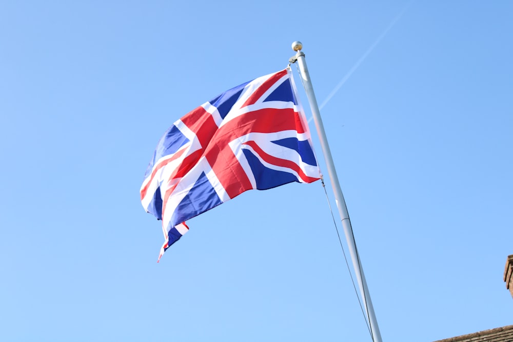 a british flag flying on top of a building