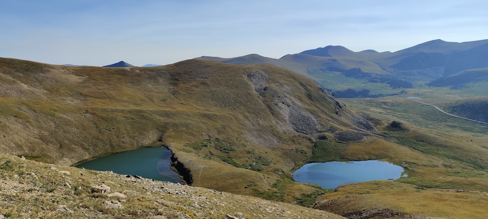 a view of a mountain range with a lake in the middle