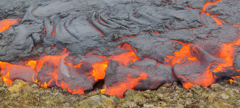 a close up of a lava rock with red hot lava
