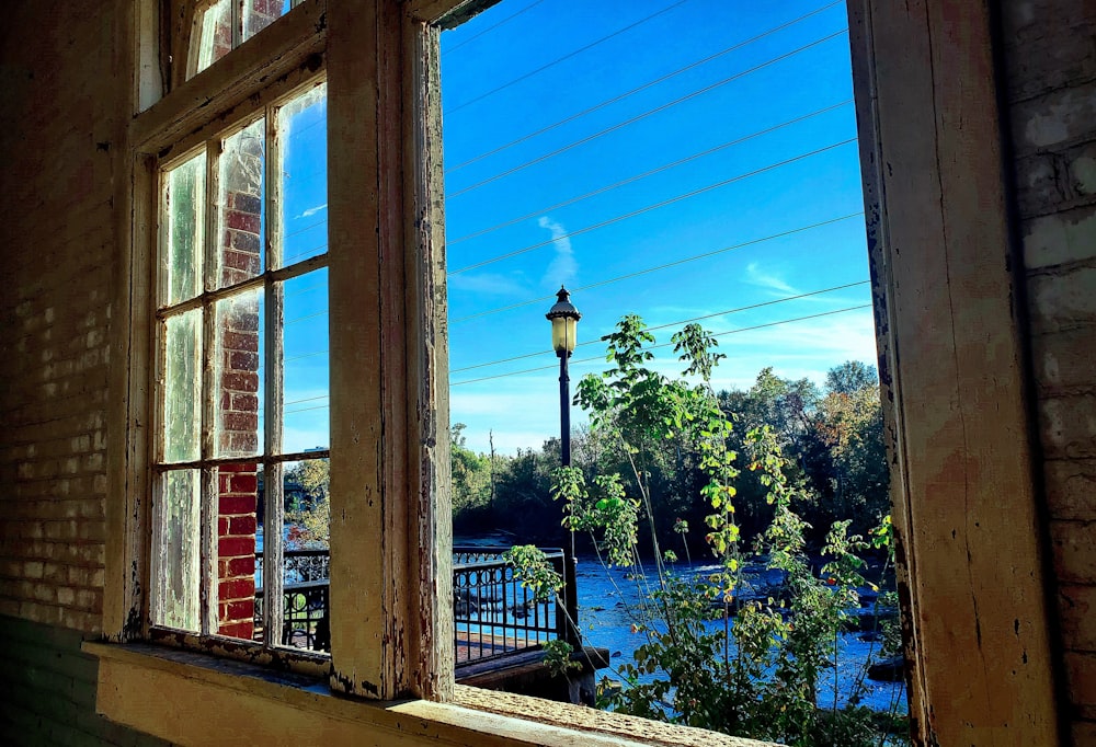 a window with a view of a body of water