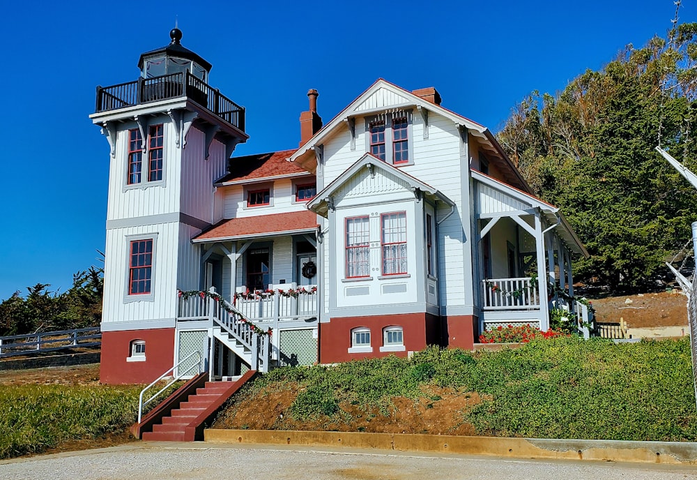 a large white house with a red roof