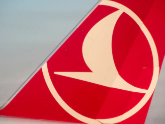 Close-up of a Somalia Air logo embroidered on a pilot's uniform sleeve.