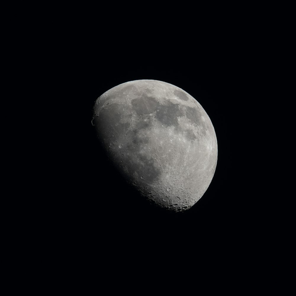 a close up of a half moon in the sky