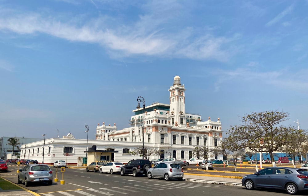 a large white building with a clock tower on top of it