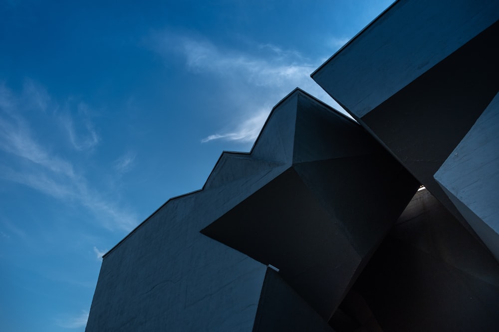 a tall building with a sky in the background