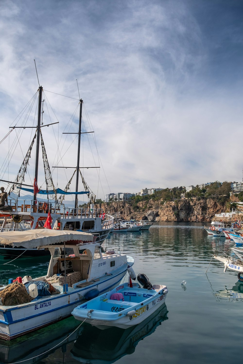 a group of boats floating on top of a body of water