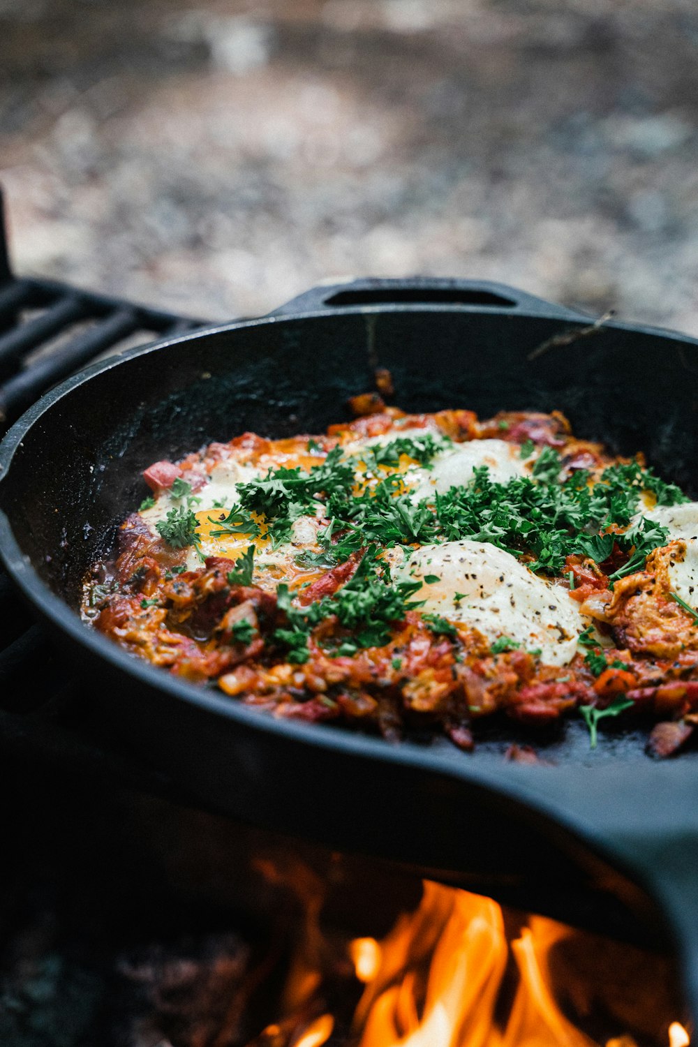 a skillet filled with eggs on top of a stove