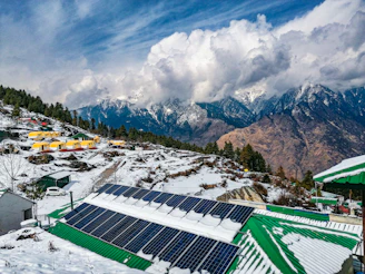a snow covered mountain with a solar panel on top of it