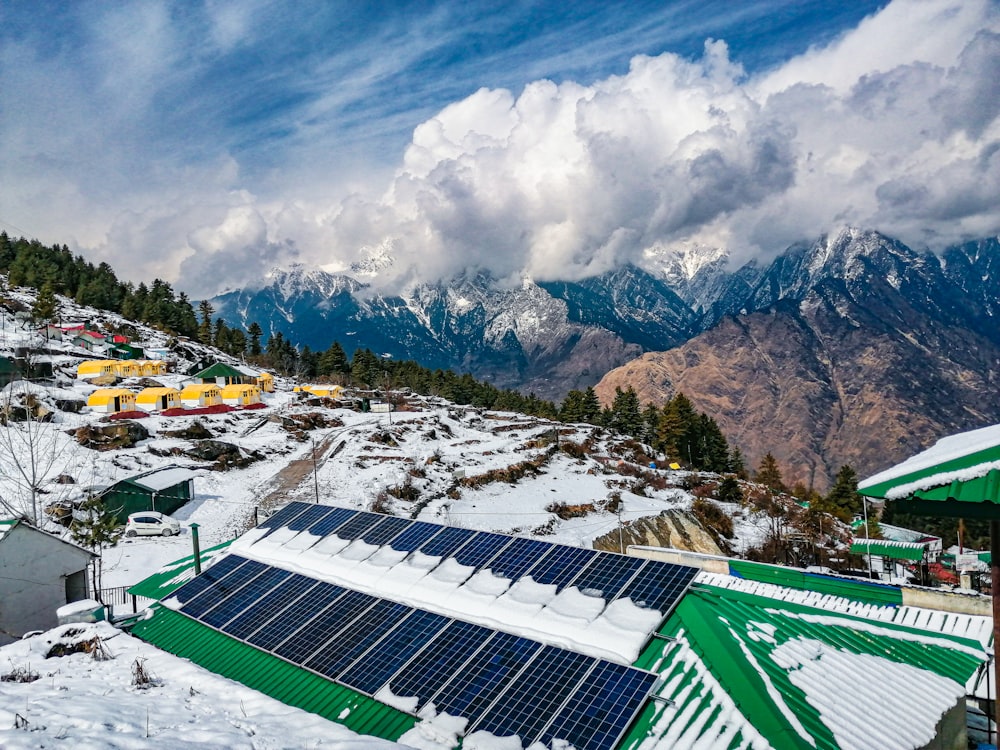 a snow covered mountain with a solar panel on top of it