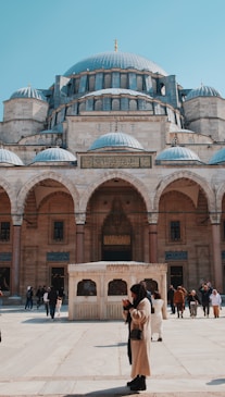 a couple of people standing in front of a building
