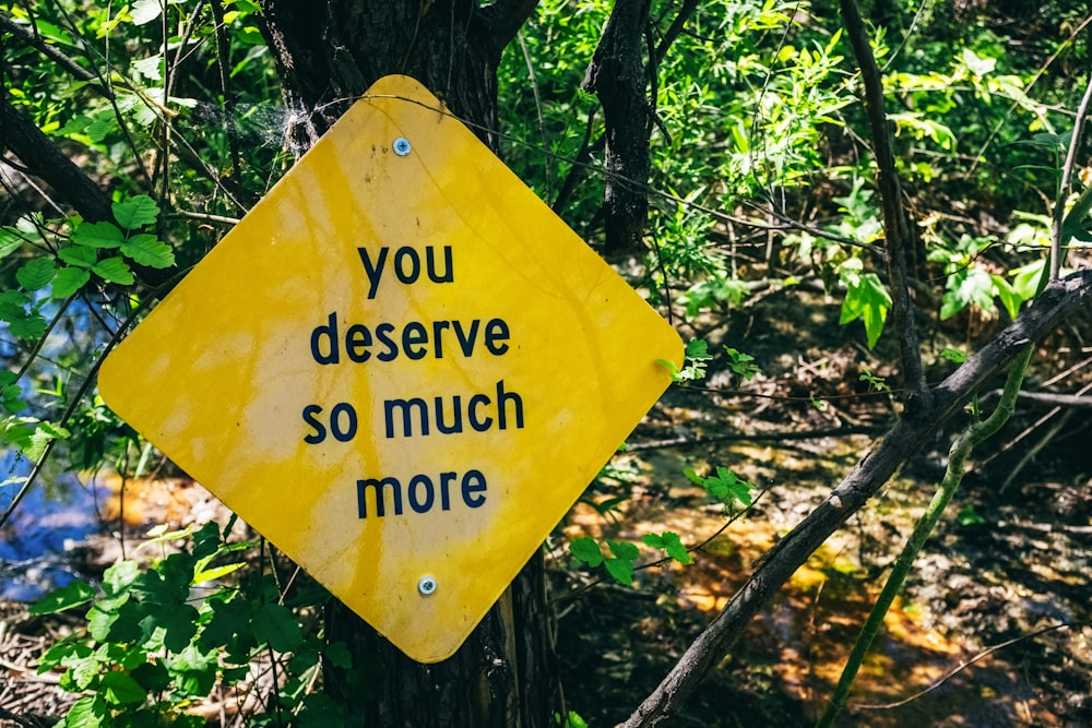 a yellow sign that says you deserves so much more
