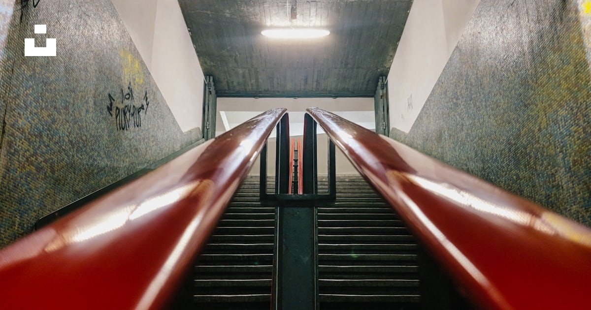 A long red rail going up a set of stairs photo – Free Lisbon Image on ...