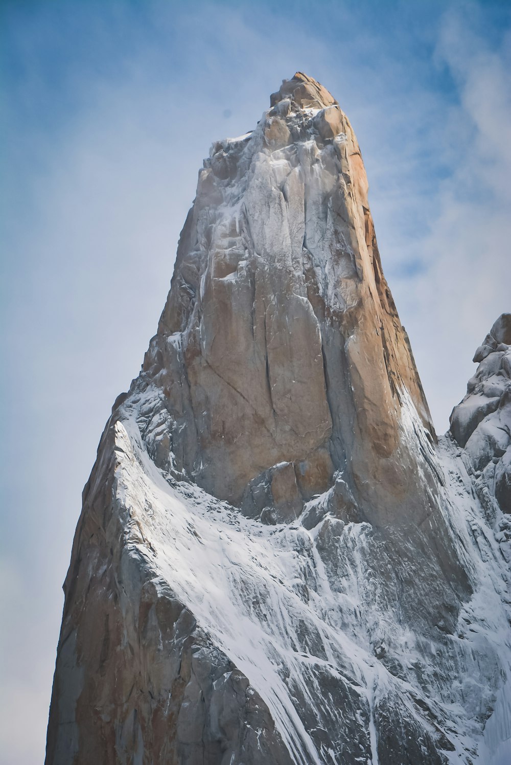 a very tall mountain with snow on it