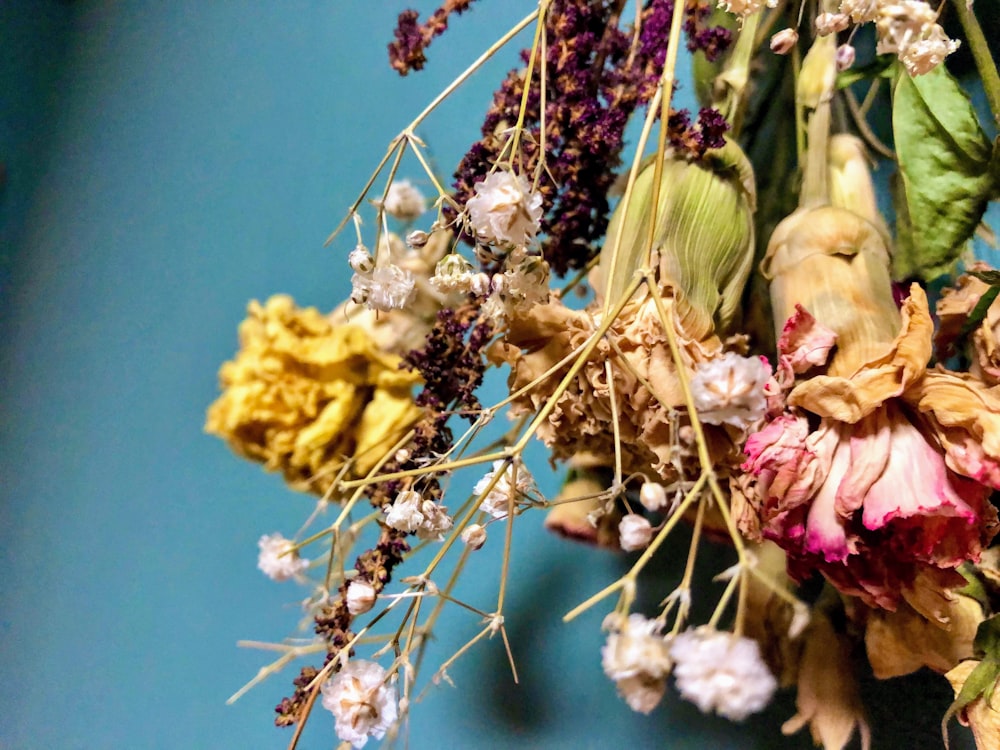 a bunch of dried flowers sitting on top of a table