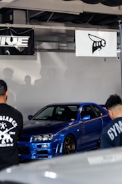 A vibrant blue-themed online marketplace showing various car parts on sale.