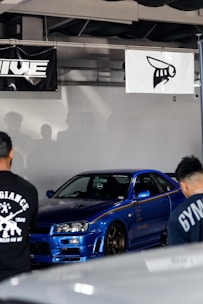 A vibrant blue-themed online marketplace interface showing various car parts sorted by brand.