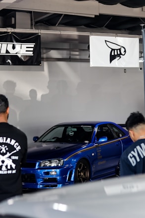 A vibrant blue-themed online marketplace showing various car parts on sale.