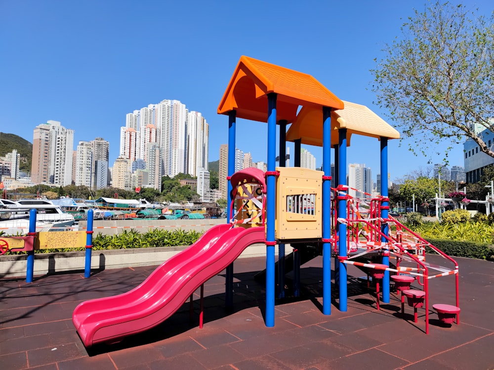 a children's play area with a pink slide
