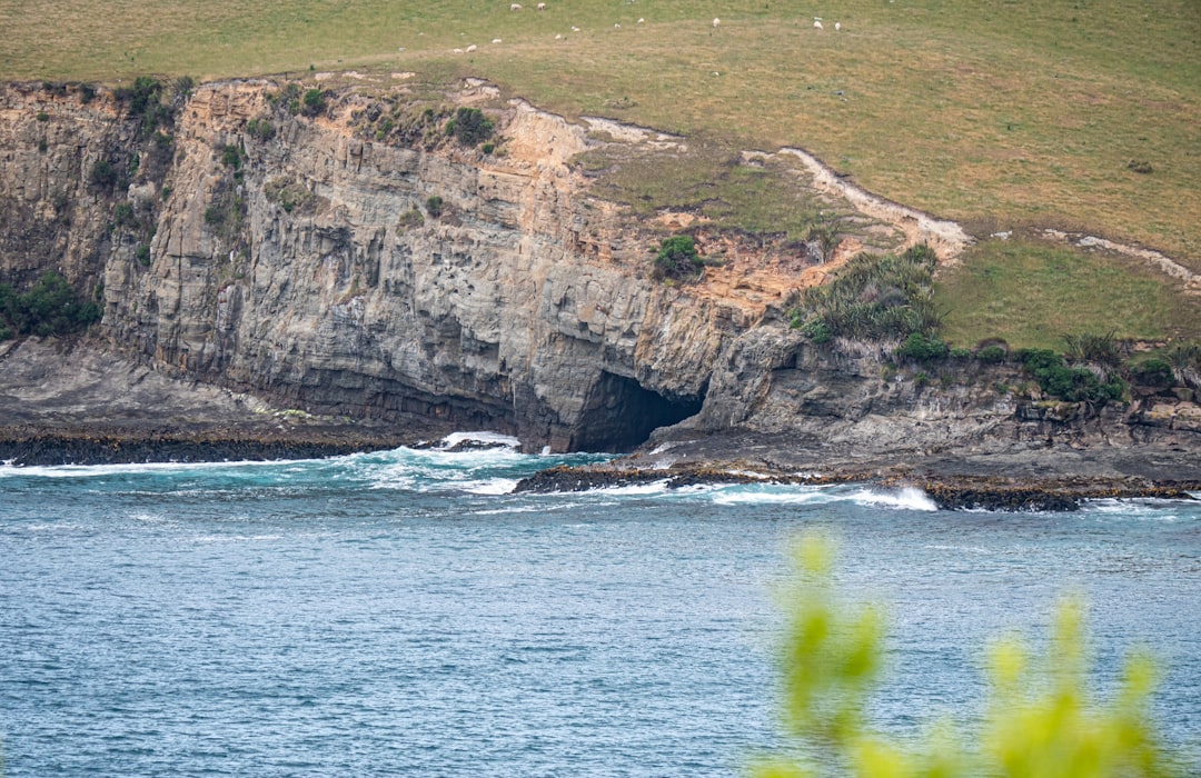 a large body of water with a cave in the middle of it,