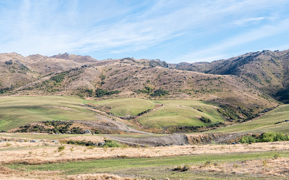 a view of a mountain range with a road going through it