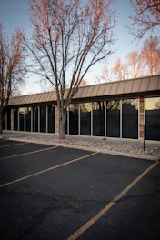 A clean, well-maintained small plaza parking lot in early morning light.