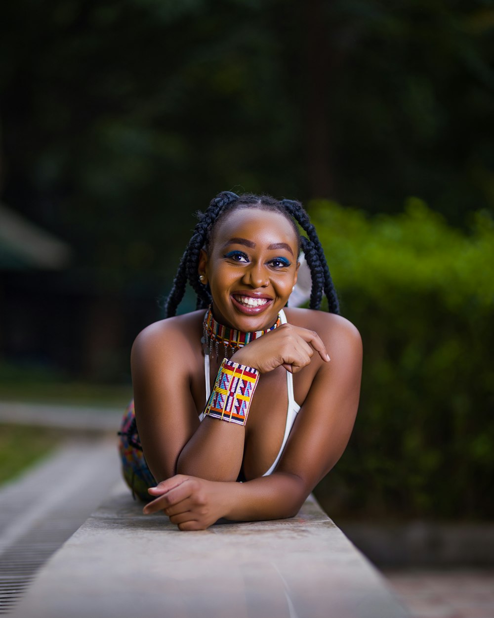 a woman with braids is posing for a picture