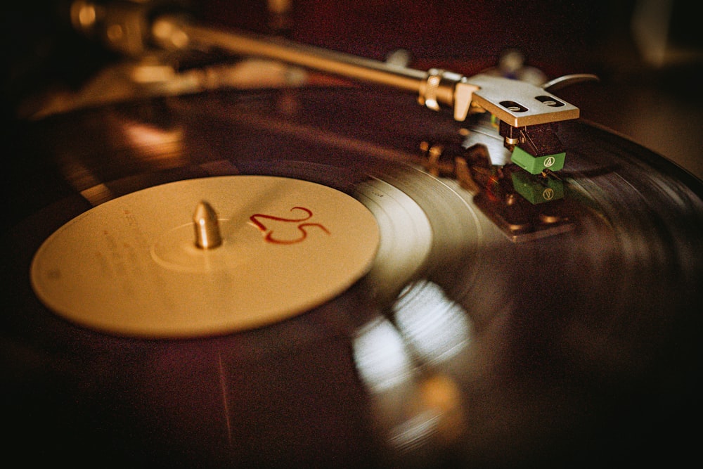 a record player with a flower on top of it