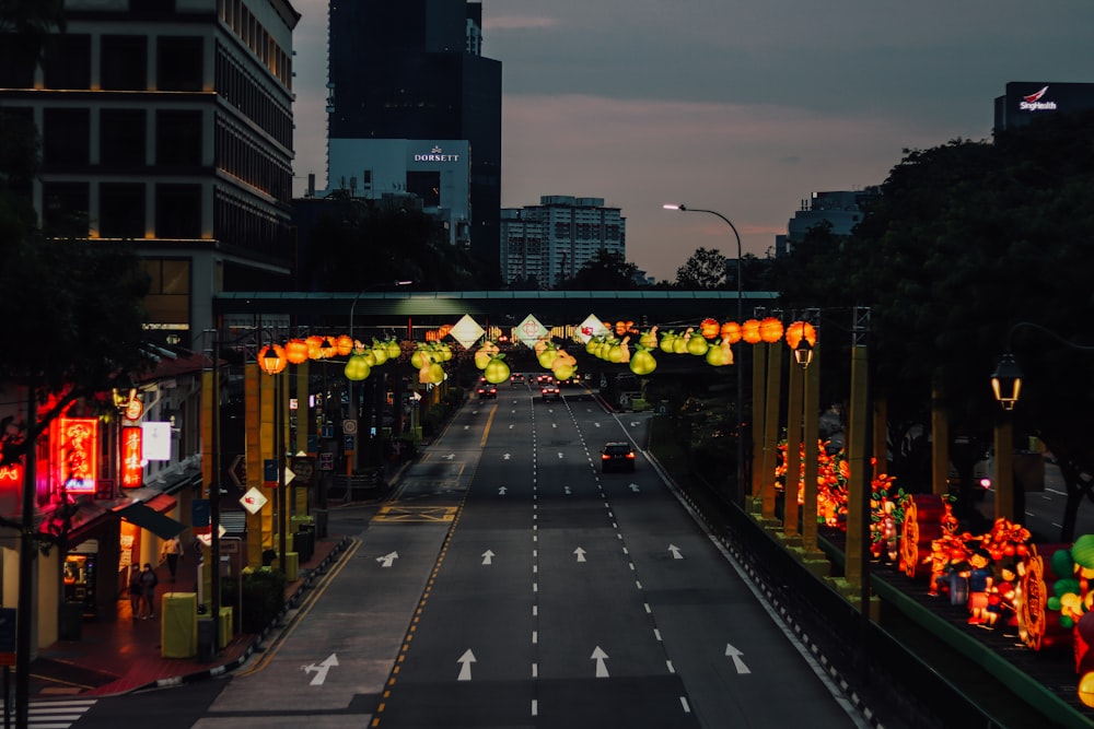 a city street with lights on both sides of it