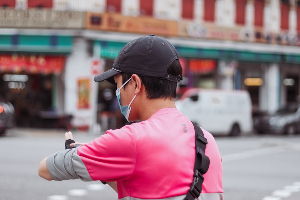 a man wearing a face mask and earphones