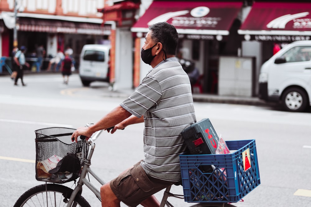 a man riding a bike down a street