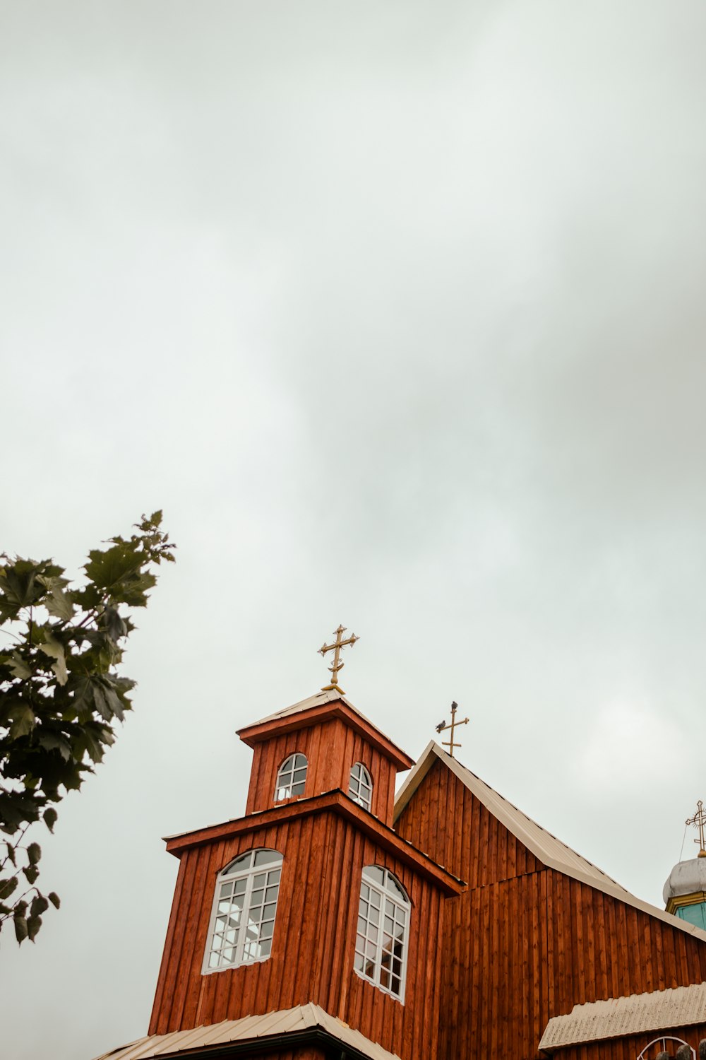 a church with a steeple and a cross on top