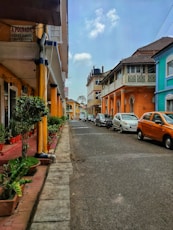 a row of parked cars on a city street