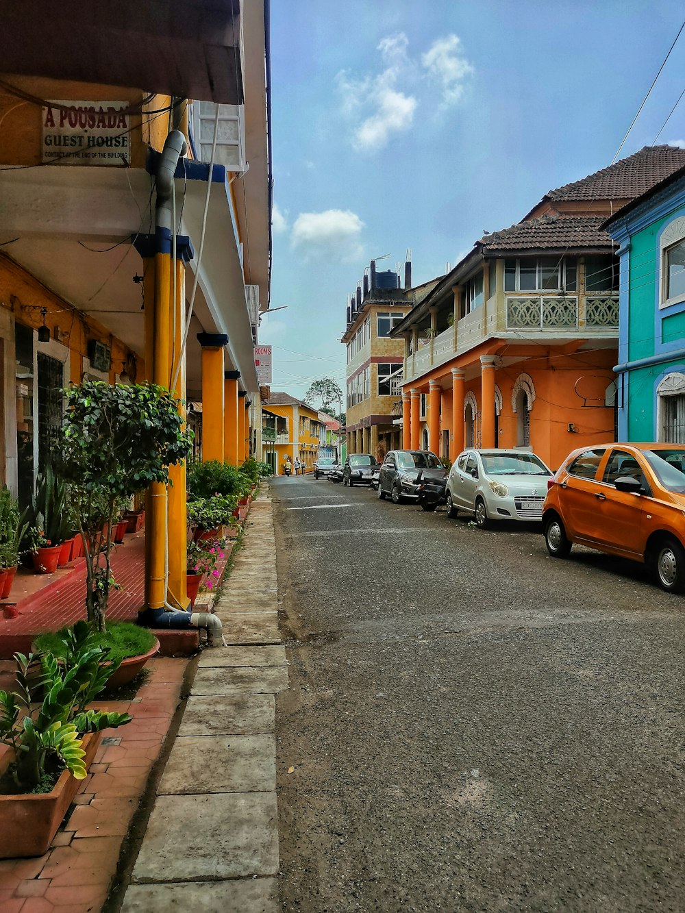 a row of parked cars on a city street