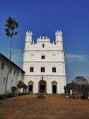 a large white building with a tall tower