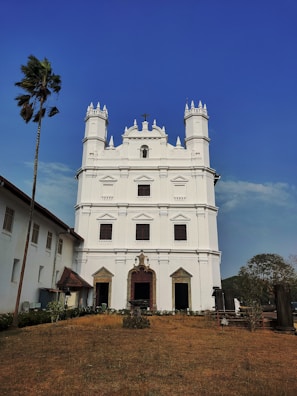 a large white building with a tall tower