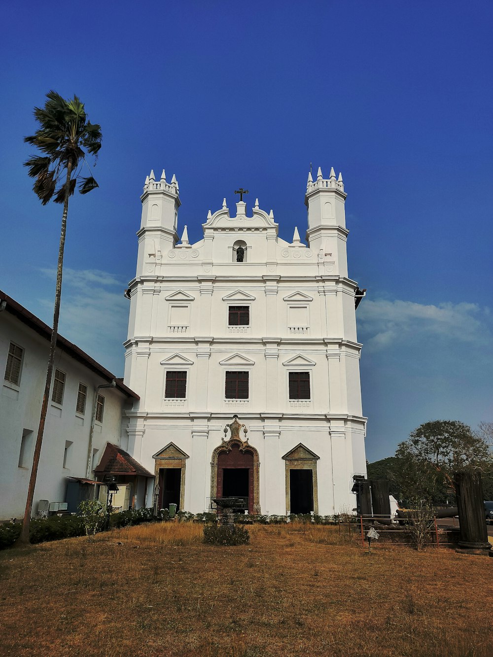 a large white building with a tall tower