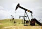 a group of oil pumps sitting on top of a field