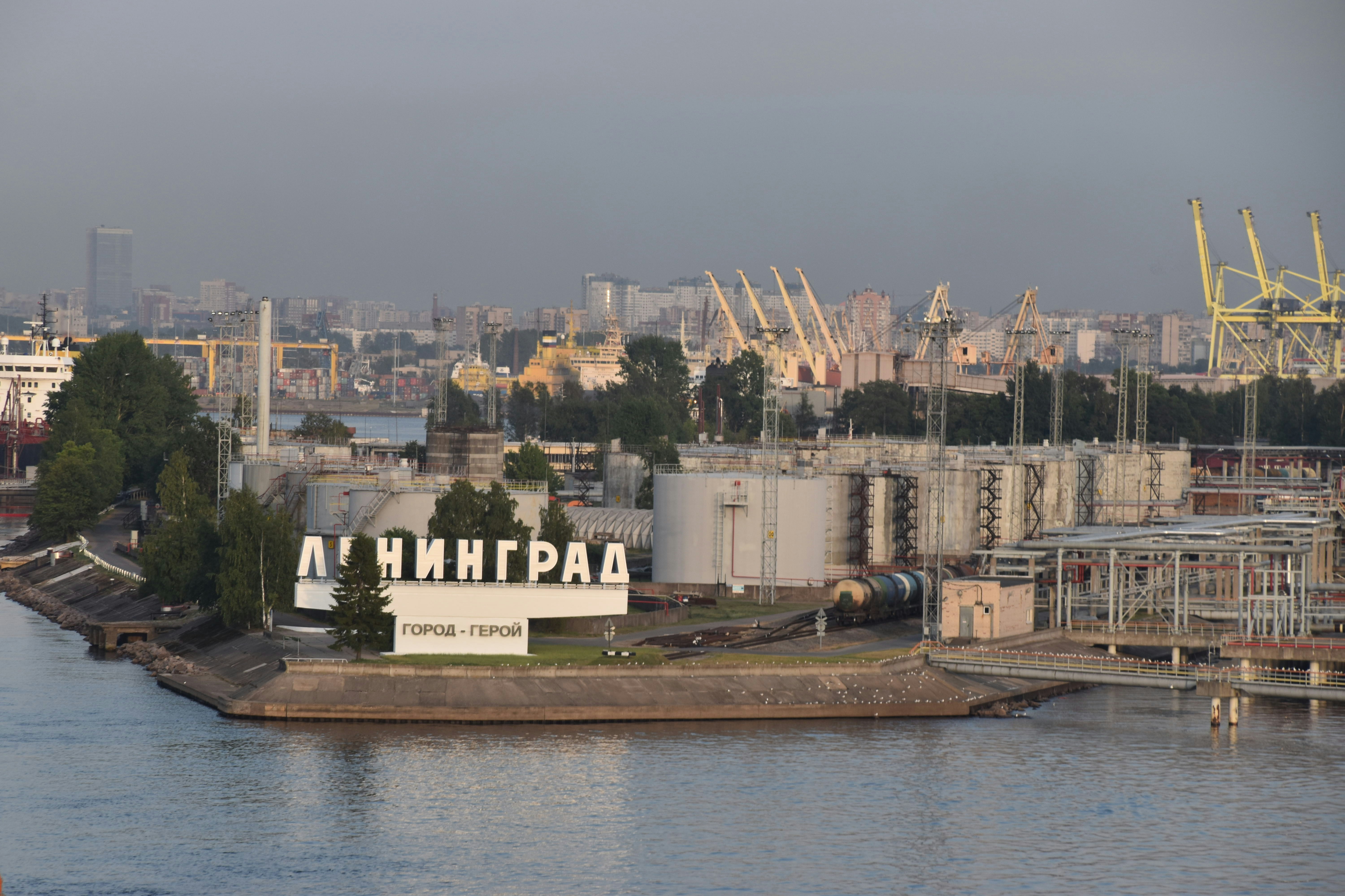 a large body of water with a city in the background