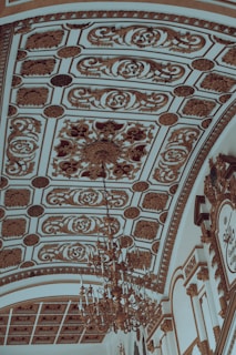A beautifully finished plaster ceiling with intricate designs.