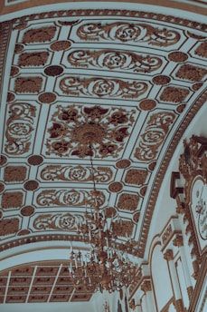 A beautifully finished plaster ceiling with intricate designs.