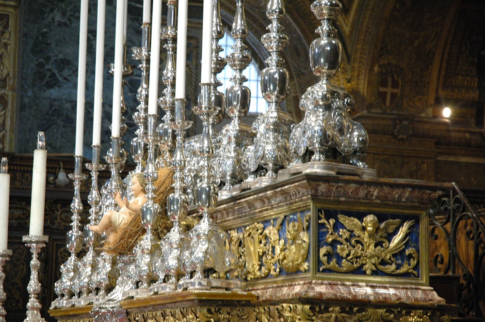 a chandelier inside of a church with candles