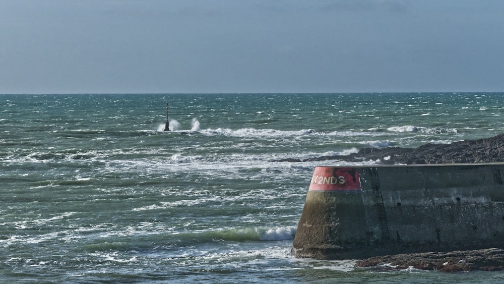 a person riding a surfboard on top of a body of water