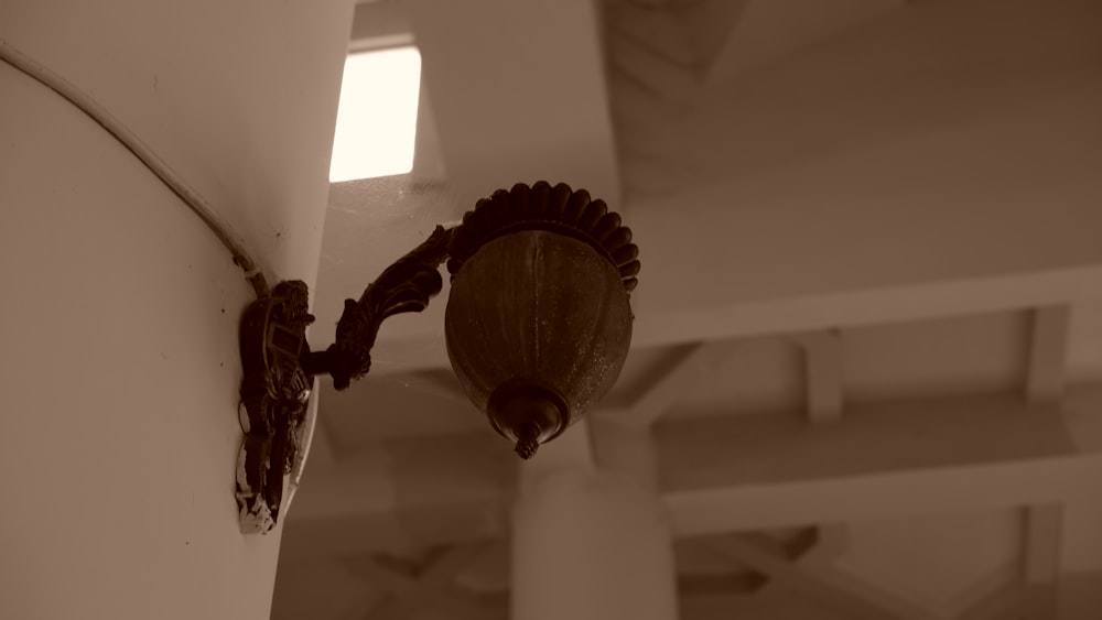 a close up of a light fixture on a wall