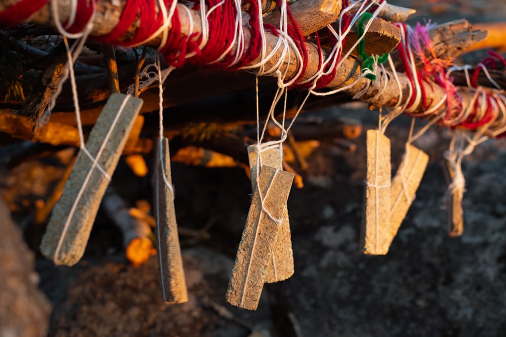 a close up of a bunch of thread hanging from a pole